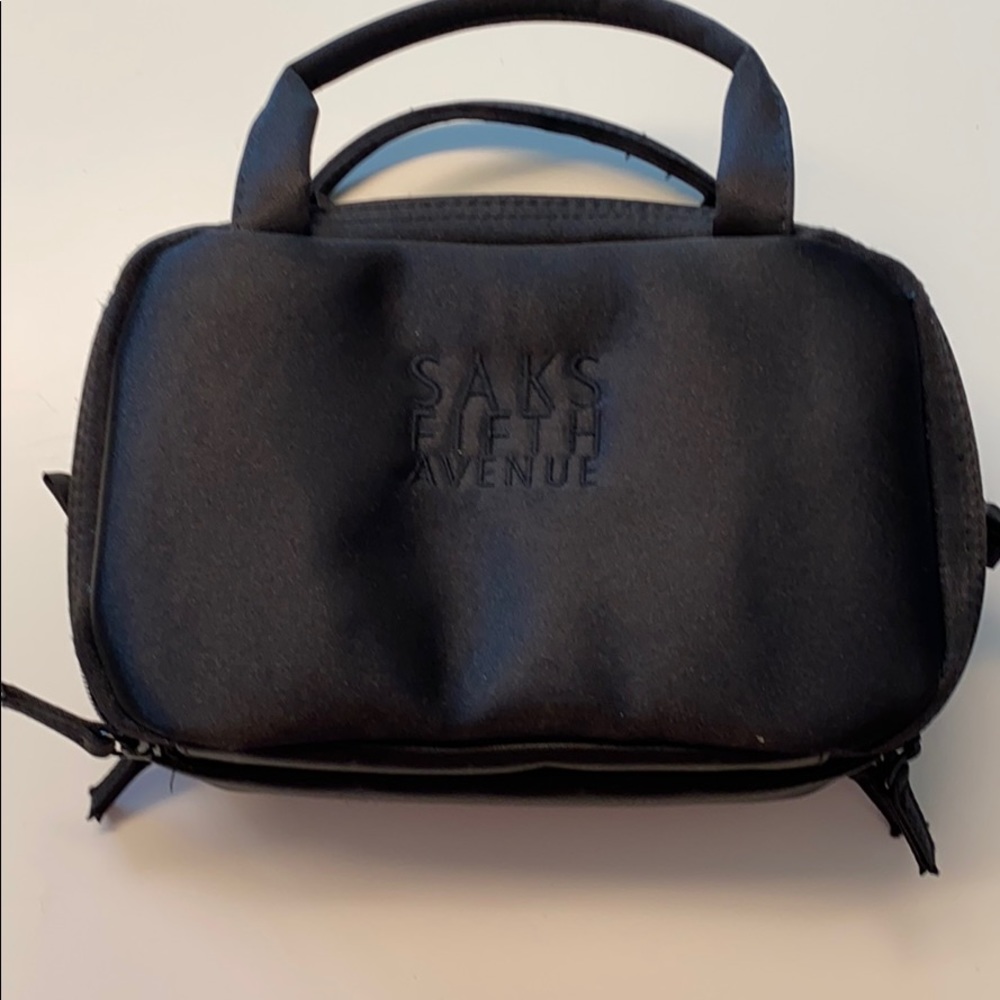 Sam’s Fifth Avenue makeup bag.